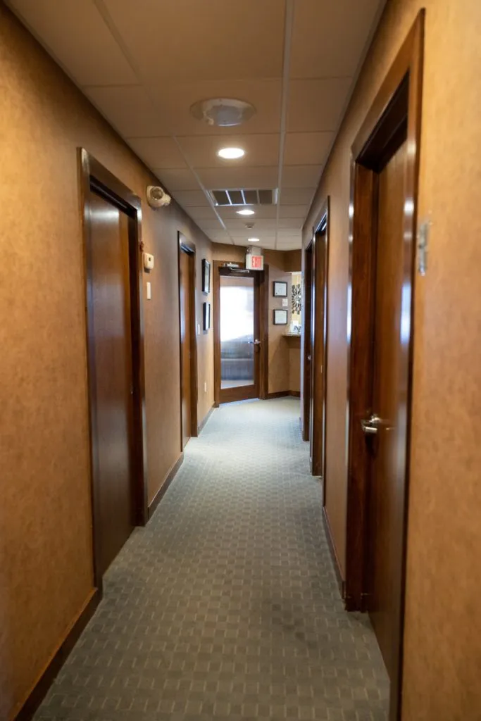 Picturing depicting the hallway to other rooms in the Zeal Dental office