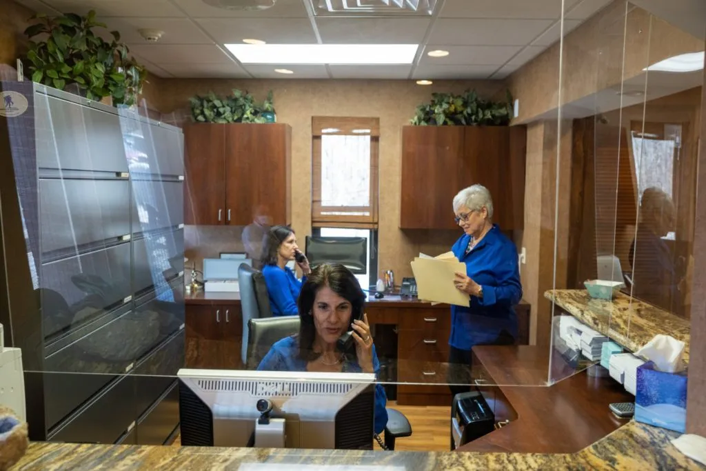 Picture of inside the Zeal Dental practice featuring Anne Reemer and office staff